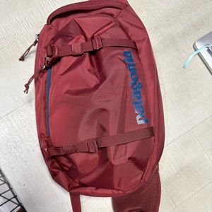 Patagonia Maroon Red Sling Backpack with Blue Logo
